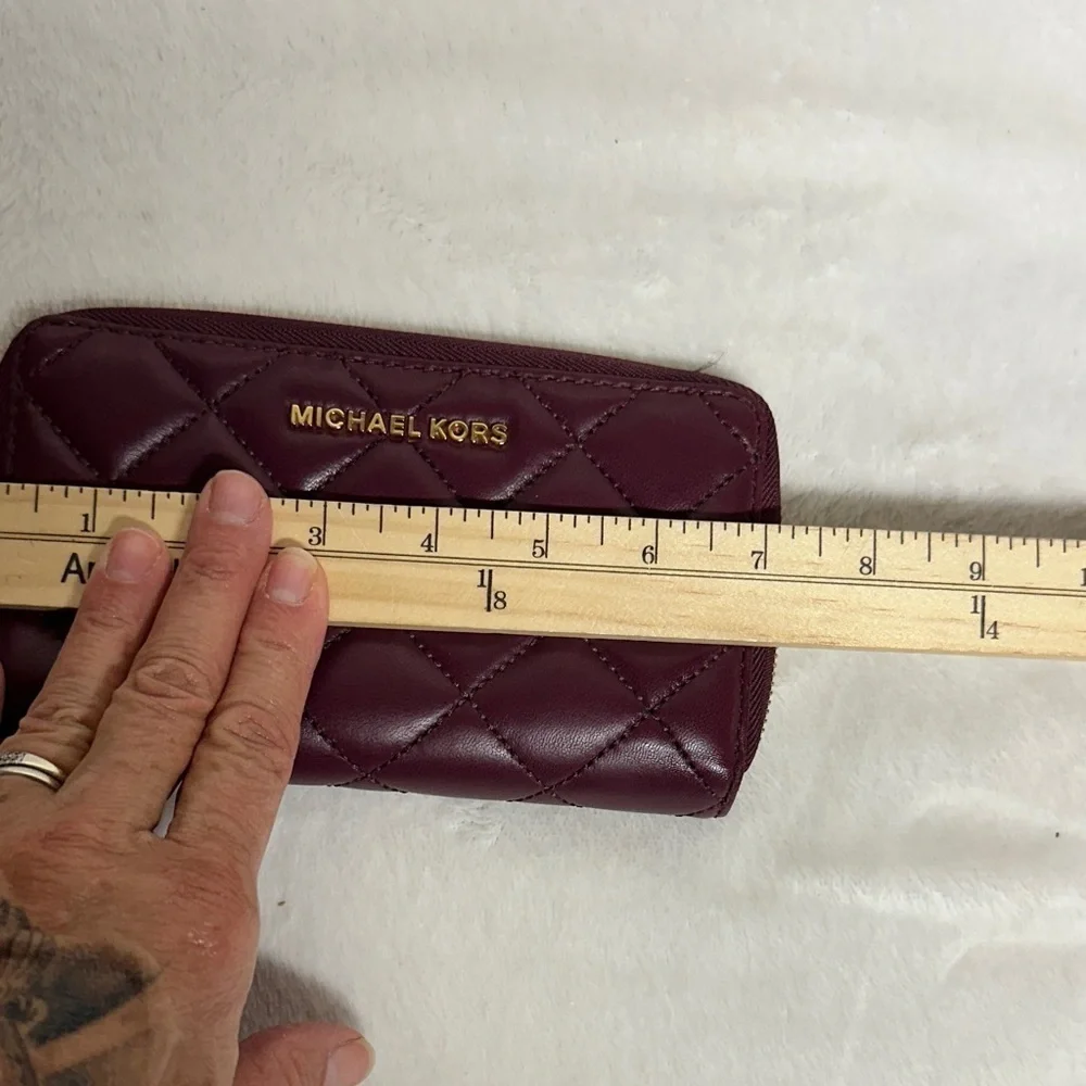 Michael Kors Plum Quilted Wristlet/ wallet